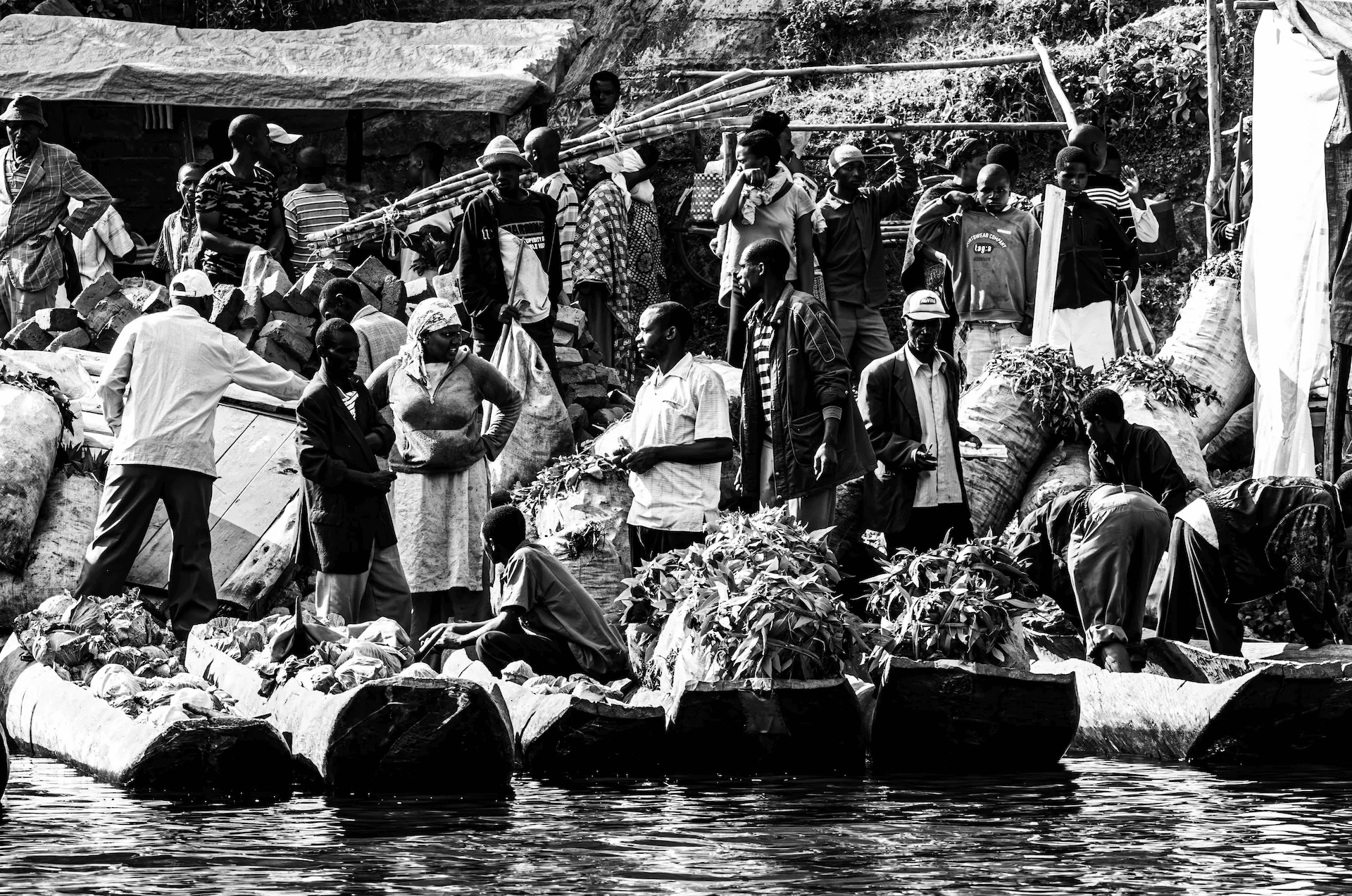 Tea Market at Lake Bunyonyi Black and white tea market scene on the shore of Lake Bunyonyi, Uganda.